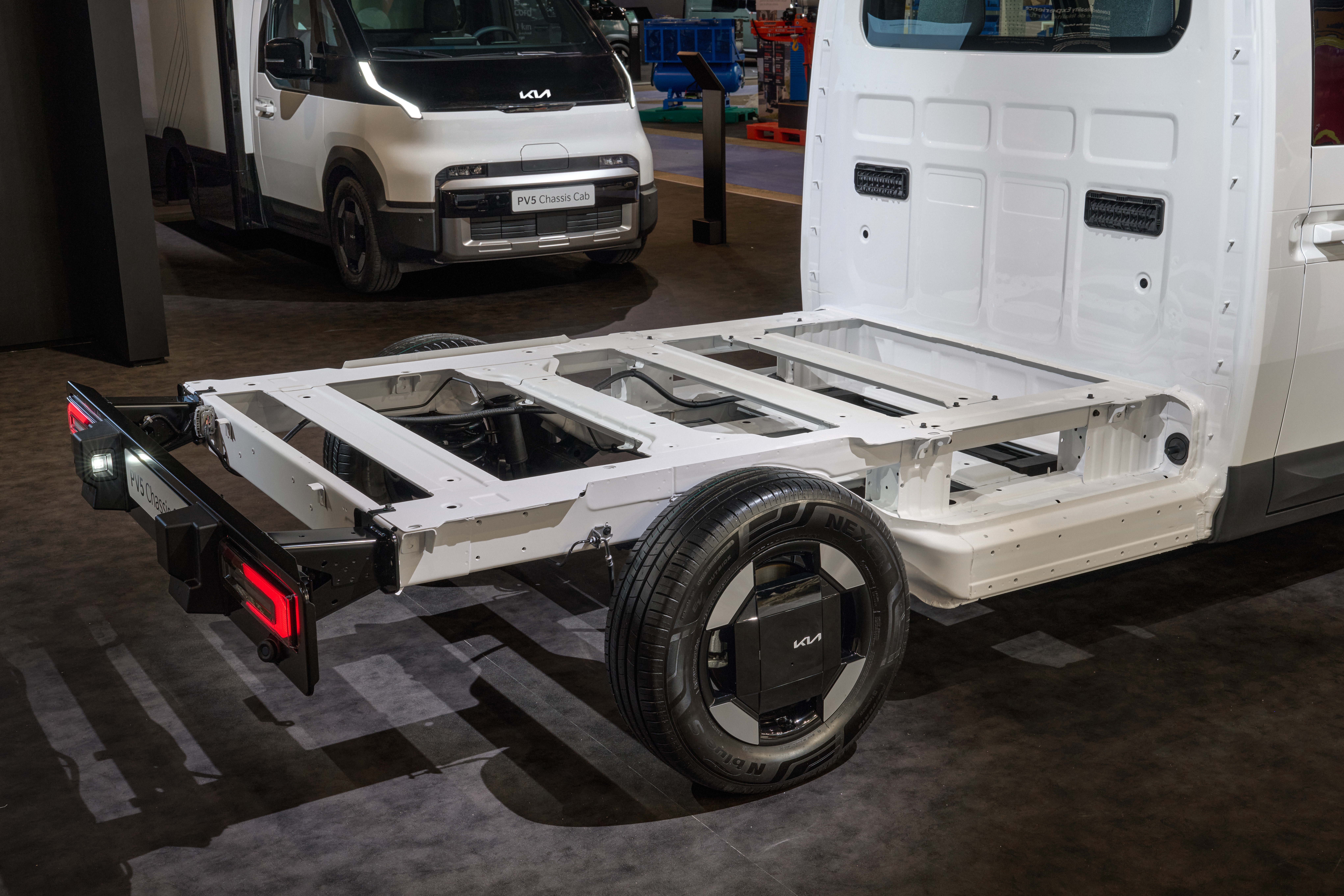 Kia PV5 Passenger billede inde i kabinen ved instrumentbrættet